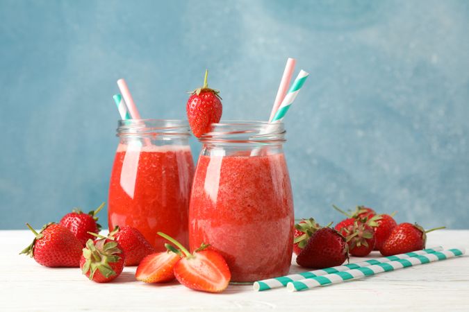 Composition with strawberry cocktails on wooden table. Summer berry