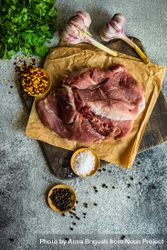 Top view of meat, spices and herbs on cutting board 5r93y1