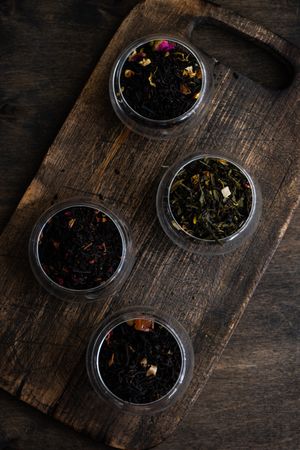 Top view of tea varieties on wooden board