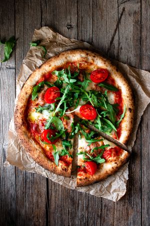 Appetizing pizza placed on wooden table