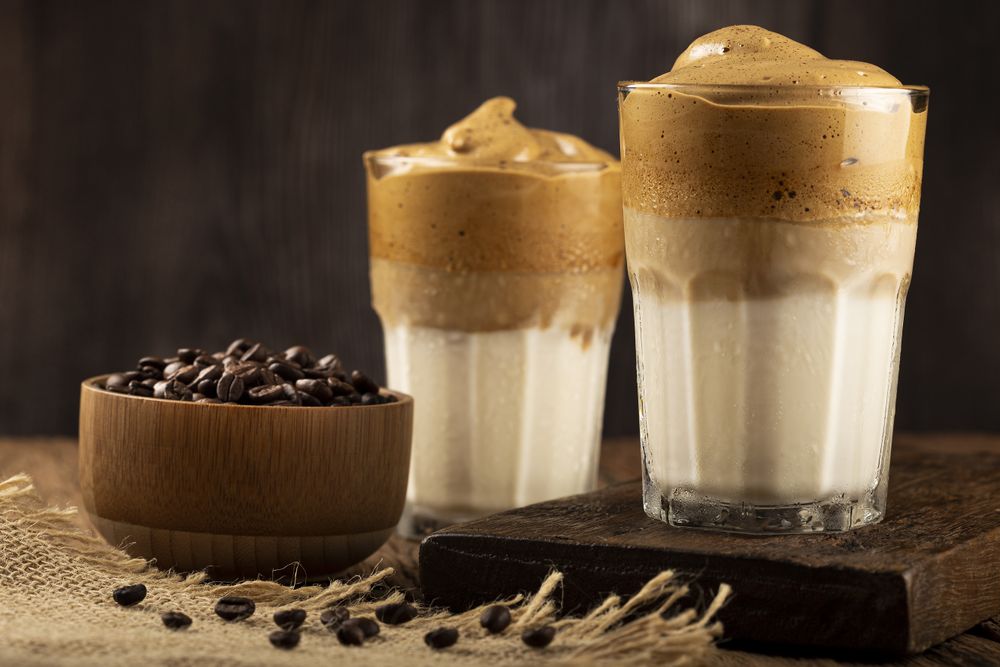 Iced Dalgona Coffee, glass with milk and coffee cream.