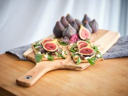 Delicious fresh fig fruits and food served on tray