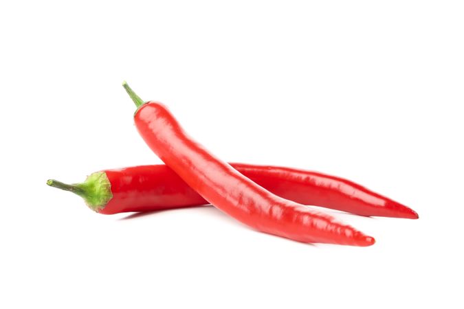 Tasty red chilli peppers isolated on blank background