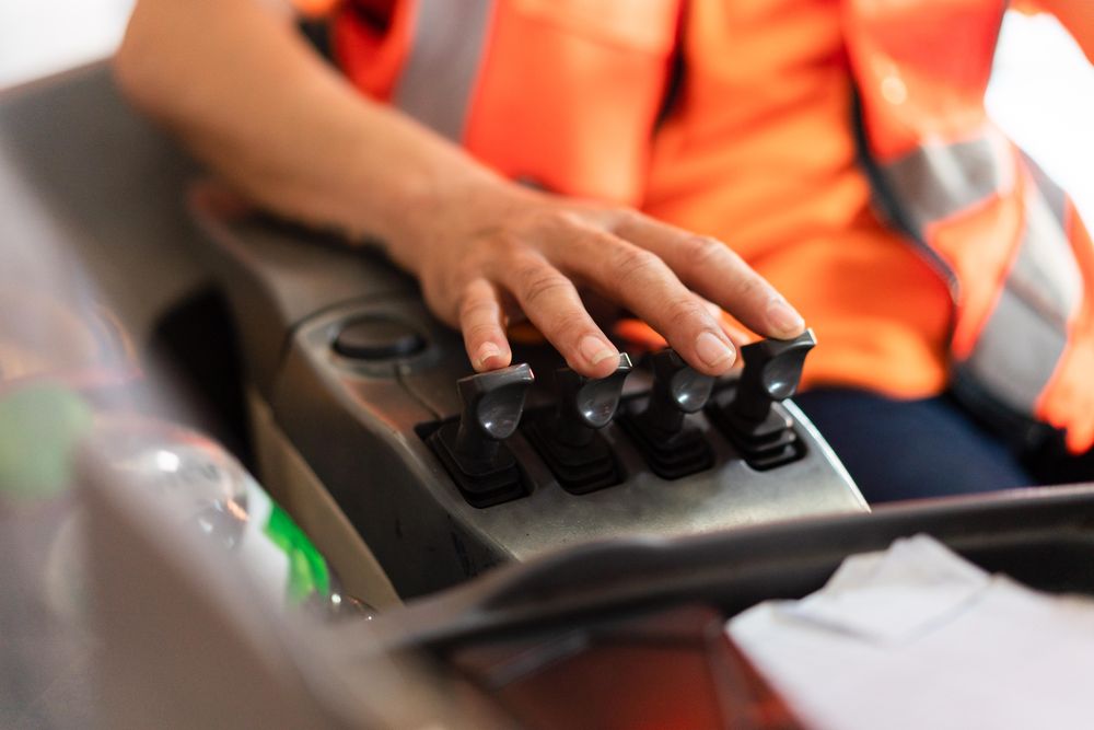 Close up of hand operating forklift
