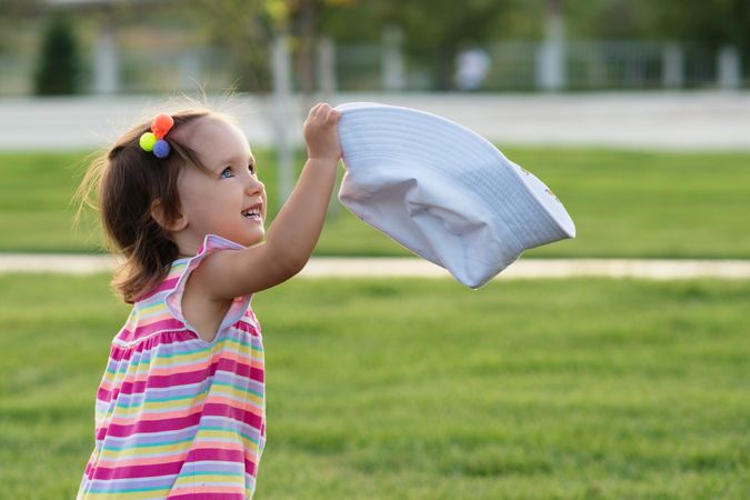 Toddler playing in summer outdoors