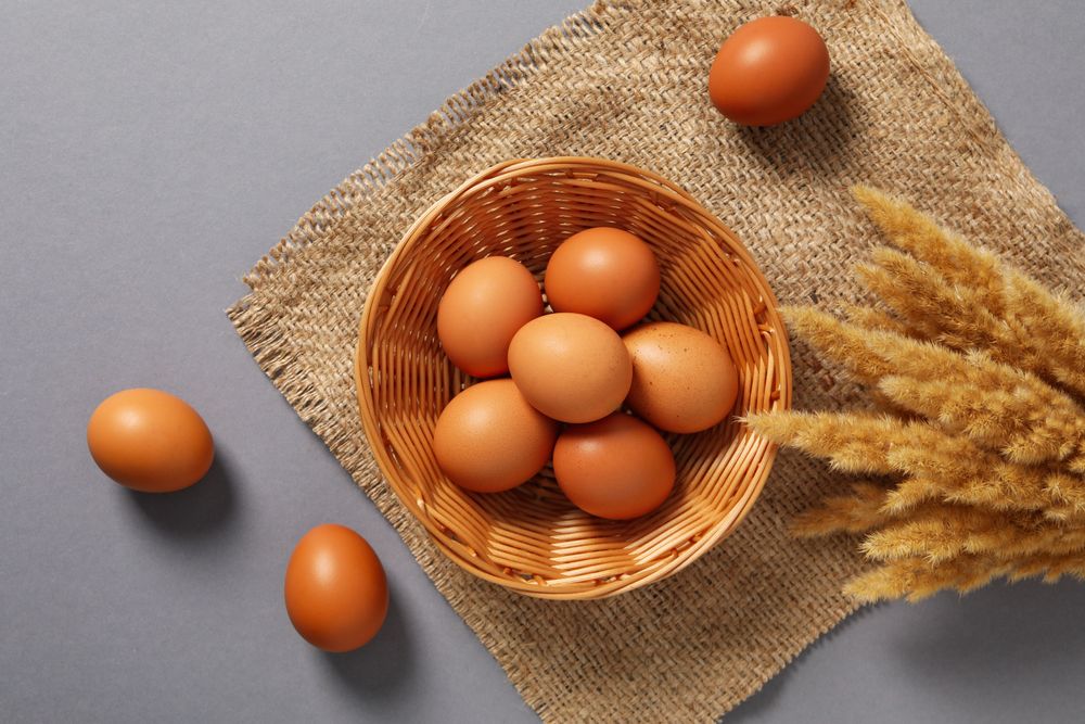 Concept of natural farm product - eggs, top view