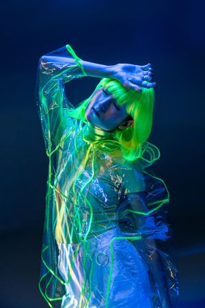 Asian woman posing in fluorescent light