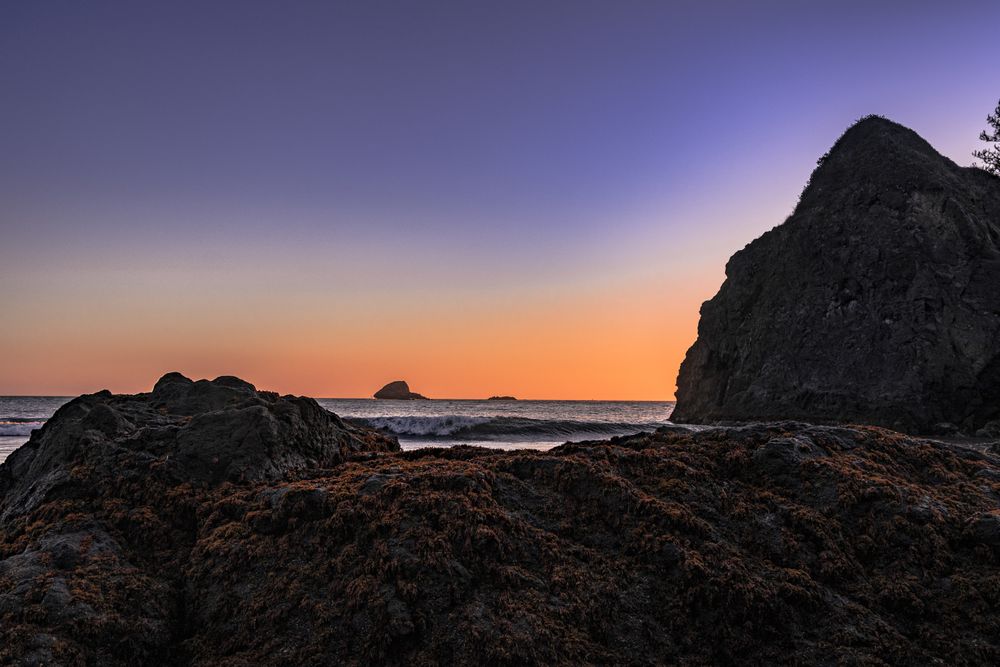Pacific Ocean coast seen from cliffs with clear colorful at sunset