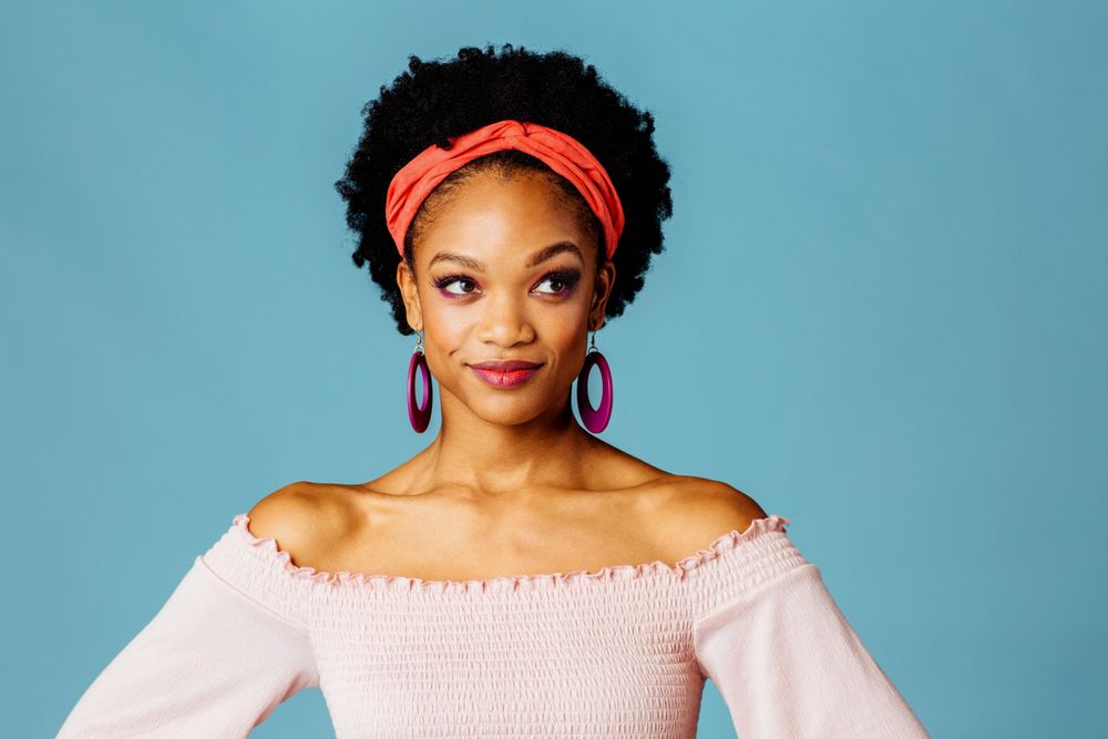 Studio shoot of curious Black woman