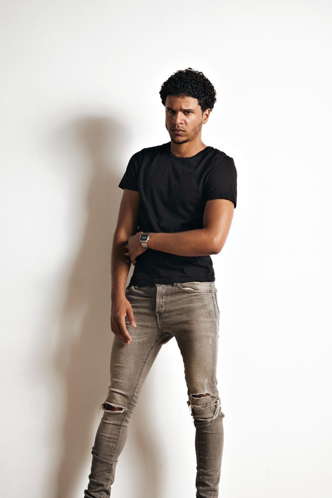 Serious man standing in studio shoot