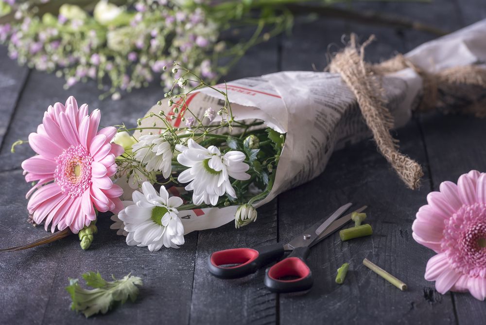 Flowers wrapped in newspaper as a bouquet
