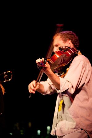 Los Angeles, CA, USA - July 12, 2012: Miguel Atwood-Ferguson playing violin onstage