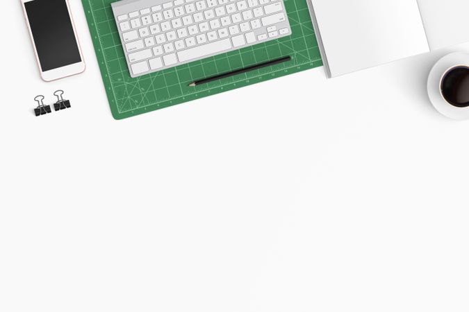 Modern workspace with coffee cup, smartphone, paper, notebook, tablet and laptop copy space