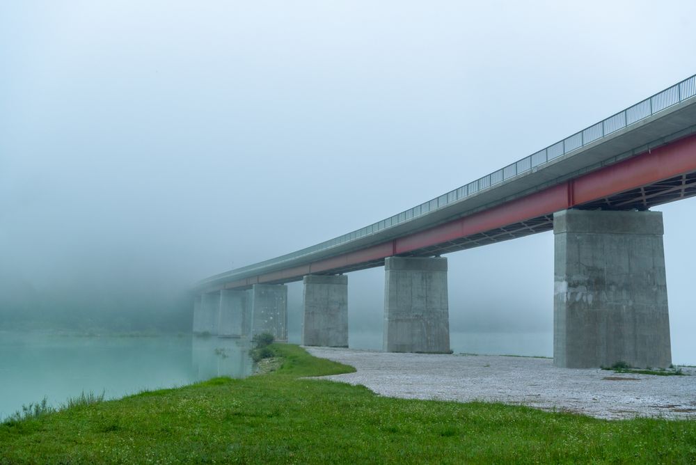 Sylvenstein Lake Bridge on a foggy morning, side view from under the bridge