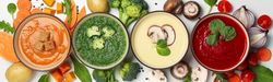 Wide shot of multi-colored vegetable soups