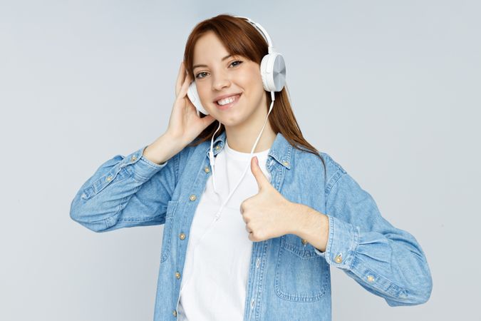 Concept of people, woman with headphones on light background