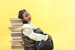 Asian Girl Sitting and Leaning on Stacked Books