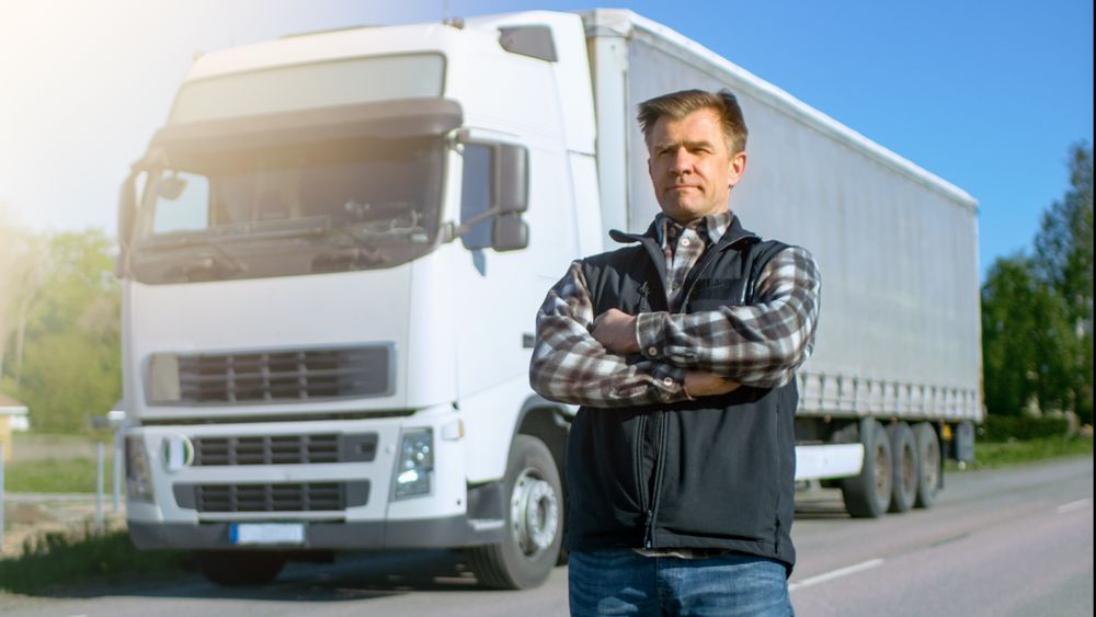 Professional Stands in the Middle of the Road and Proudly Crosses Arms.