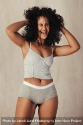 Happy female model celebrating her natural body wearing underwear 5pVRwb