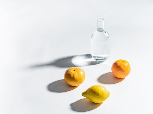 Composition of citrus and jar of water