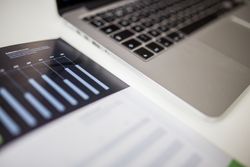 Charts next to laptop