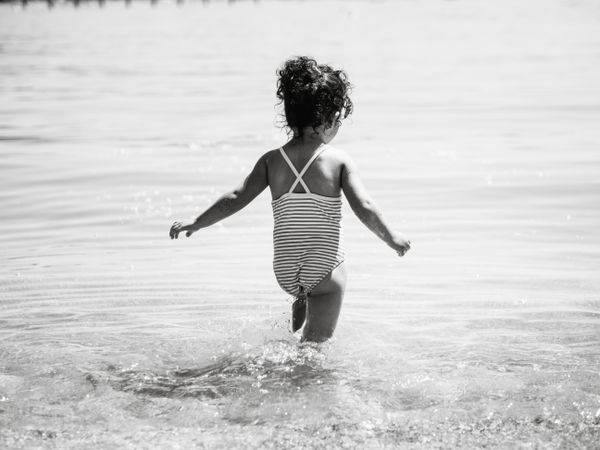 Cheerful girl having fun in warm sea