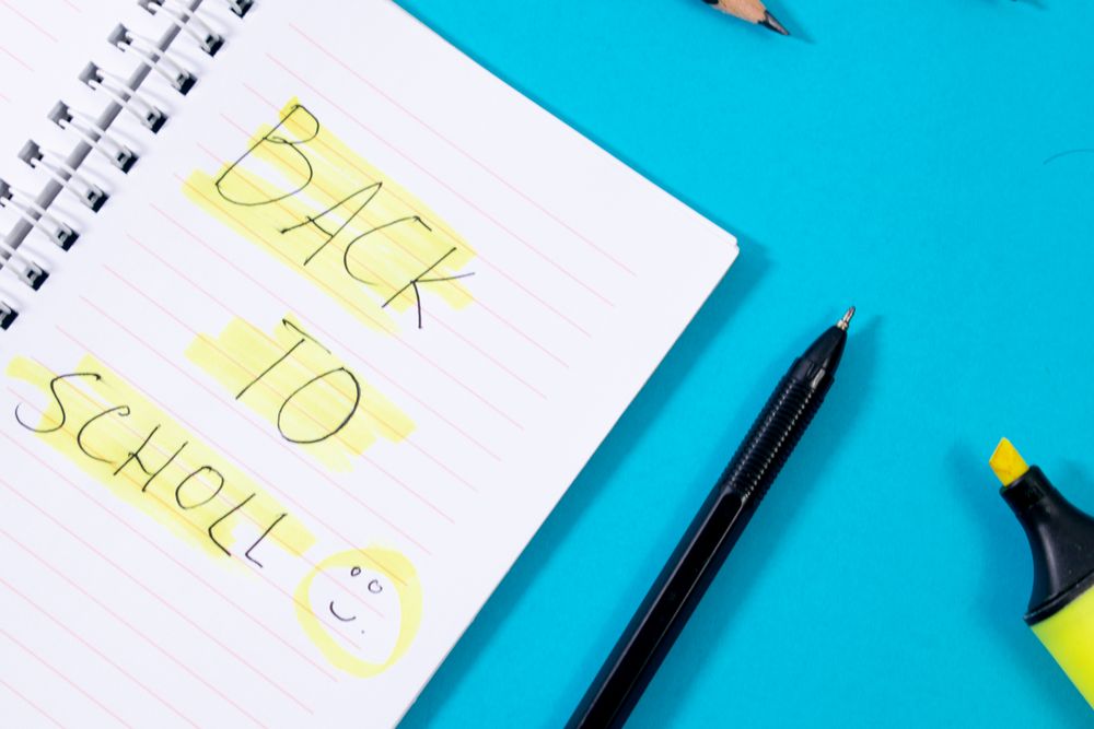 Notebook with writing Back to School with green stabilo