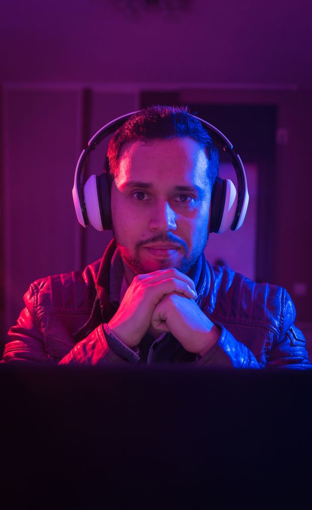 Man listening cheerfully to music with headphones.