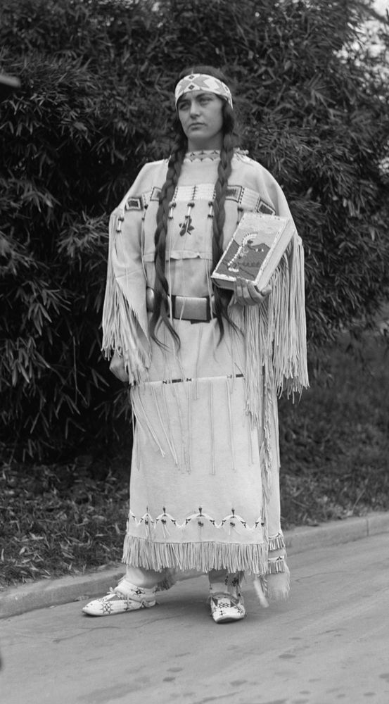Ruth Muskrat Bronson, a Cherokee, holds a copy of The Red Man in the United States