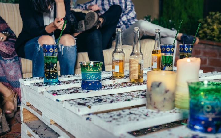 Beverages on pallet table with confetti in outdoors party