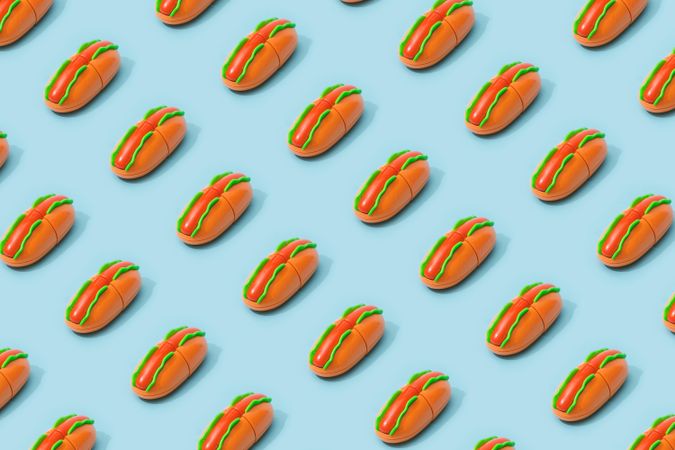 Hot dog fast food pattern on pastel blue background