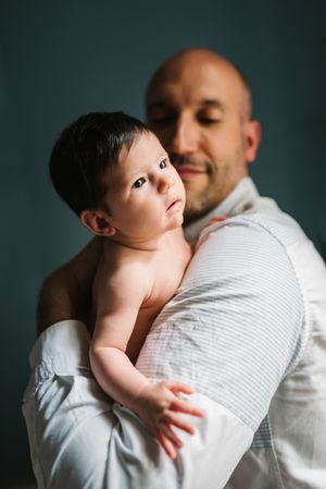 Father hugging cute baby