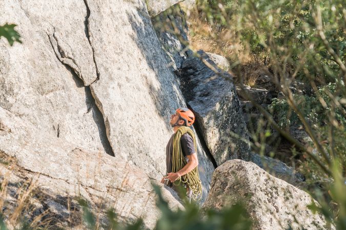 A rock climber is staring at the mountain