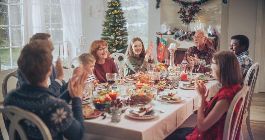Family and Friends Gather at Home for a Traditional Christmas Dinner with a Turkey Roast.