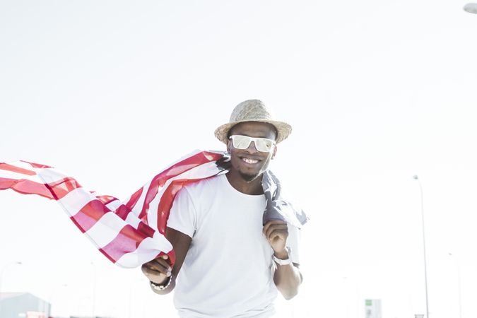 Cheerful black man with American flag