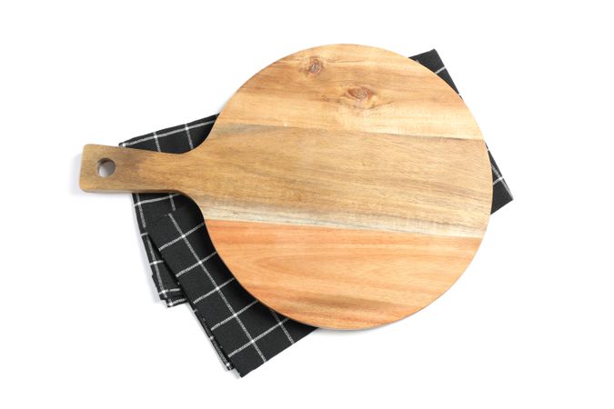 Cutting board with kitchen towel isolated on blank background, top view