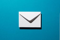 One light envelope over teal background