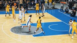 TV Broadcast Style Footage Of Basketball Championship: Yellow Team Passing the Ball Between Teammates