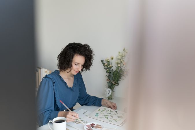 Woman painter working at home