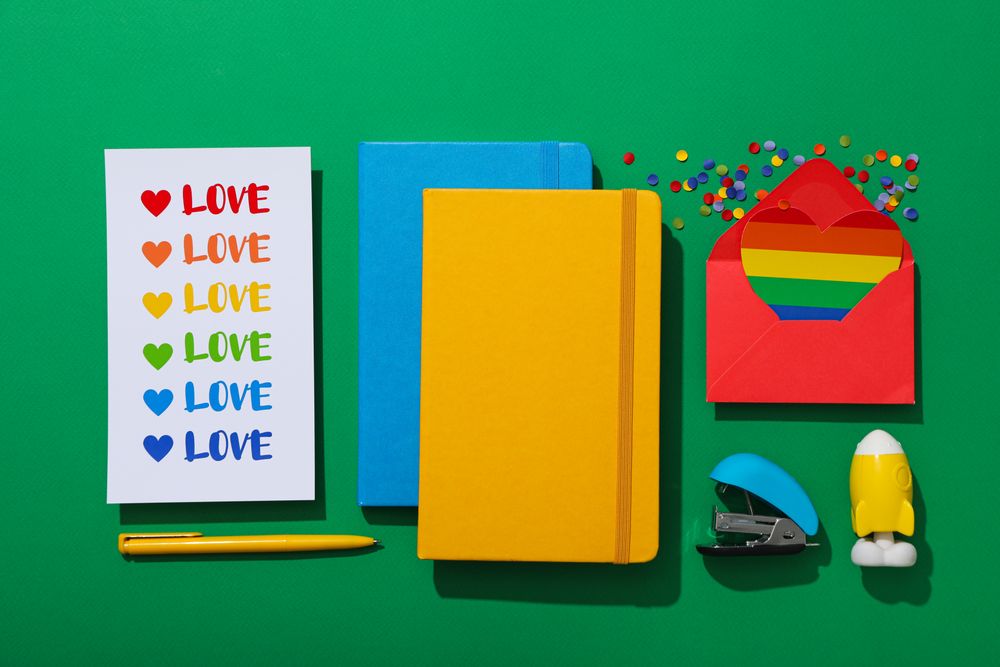 Pride parade concept, envelope on green background.