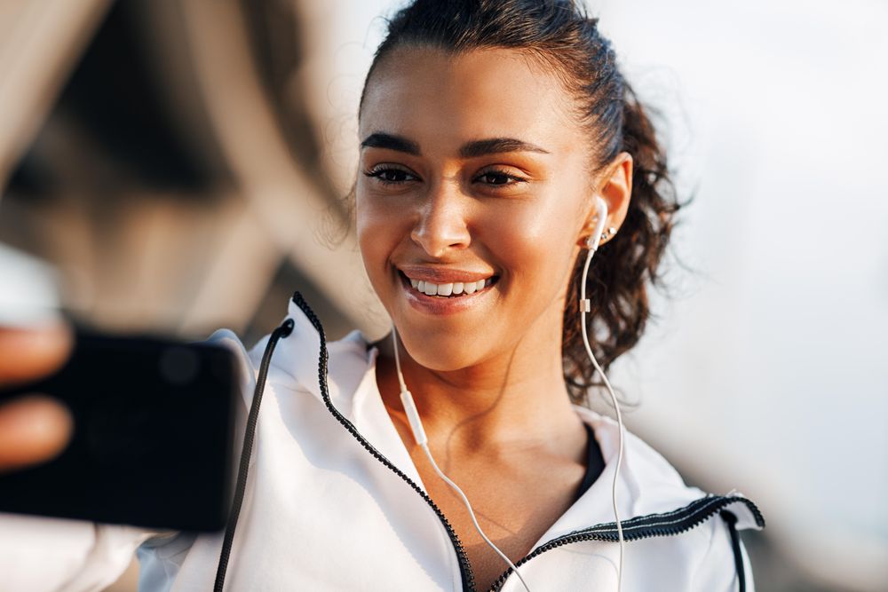 Woman in exercise gear taking a FaceTime call