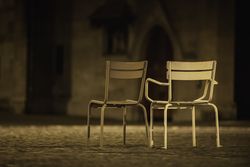 Two Empty chairs side by side in street