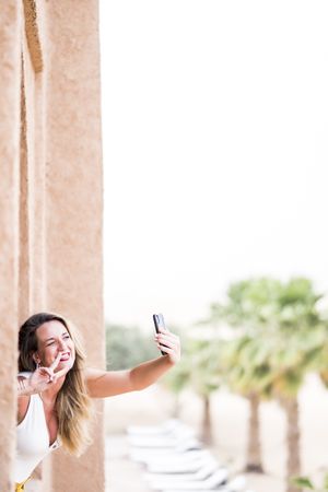 Woman making a selfie in balcony