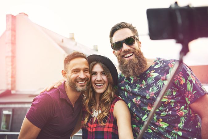 Happy group of people taking a selfie