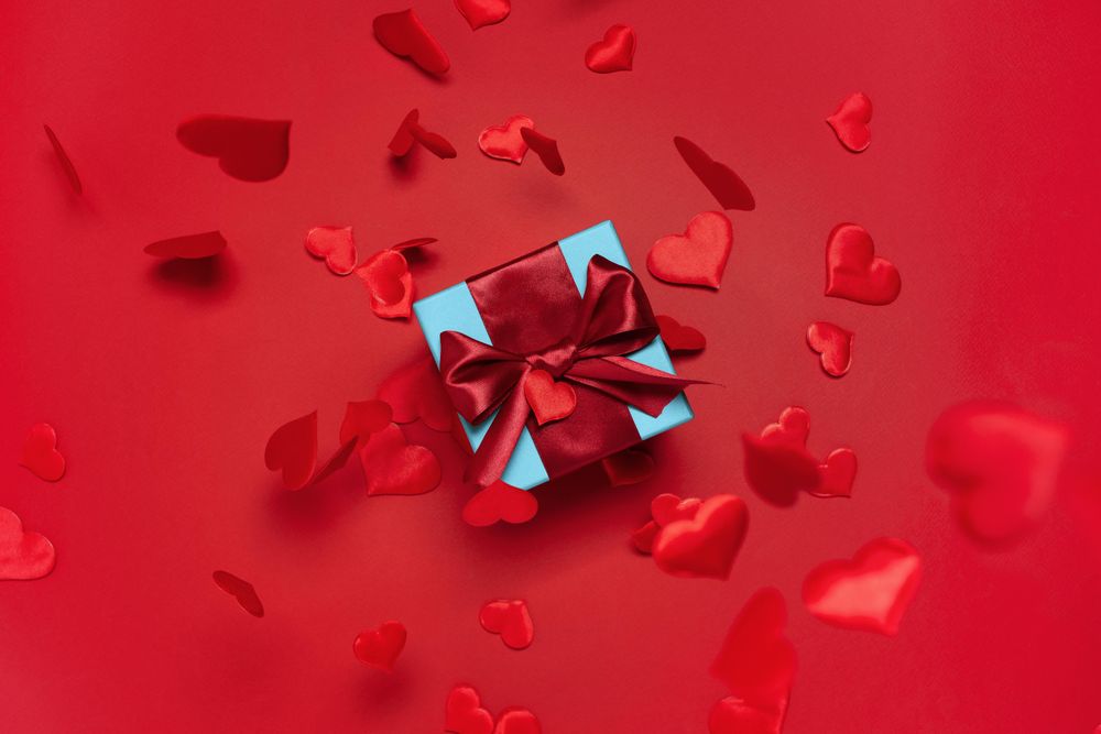 Blue box with red bow on red background