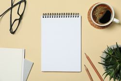 Office concept with blank notebook on beige background, space for text