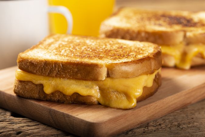 Grilled ham and cheese. Sandwich with cheese and ham on grill.