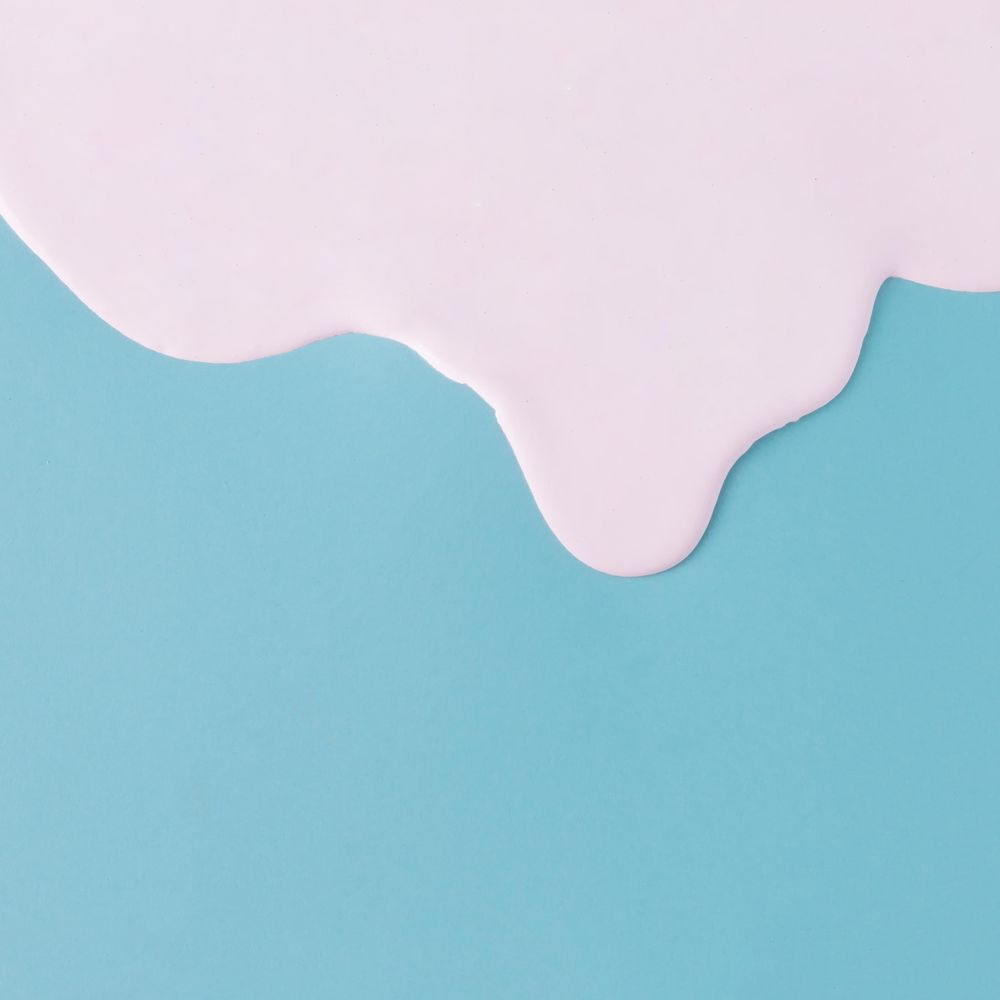 Abstract pink oil paint dripping texture on blue canvas