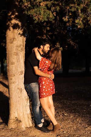 Young happy couple embracing in beautiful garden