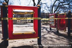 MONTREAL, QUEBEC, CANADA – March 31 2020- Playground closed down with 'danger' yellow tape bEQdob